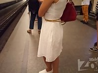 Up2693# Tanned brunette in a white dress. Our operator saw her in the subway car and followed her. E