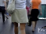 Up2391# Tanned brunette in a short gray skirt. Our cameraman filmed on hidden camera her gorgeous ro