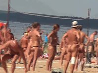 Nu1718# Nude beach voyeur cam is a report from the volleyball court. Naked people playing with a b