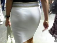 Up2318# Blonde in a short white skirt. Beautiful round ass in white thong. In the subway you can fin