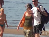 Nu1724# Slim brunette undressing and going to sunbathe slowly. Excellent footage nude beach voyeur