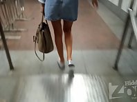 Up2806# Upskirt tanned girl in a short denim skirt. Our operator filmed on her hidden camera her chi