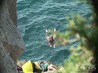 Nu1217# We continue to see a young girl on a nudist beach. She decided to jump off a cliff into th