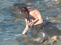 Nu2395# A naked chick washes her body in the coastal waves - a very beautiful sight! Her youthful bo