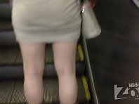 Up1762# Beauty in a short gray skirt. My attention was caught her round ass in tight skirt. Excell