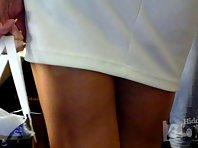 Up2803# Upskirt to a mature girl in a short white skirt. Another good model for filming upskirt in t