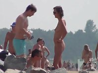 Nu1367# Nude beach voyeur cam is noticed another beauty in the crowd and focused on her. Tall, sle
