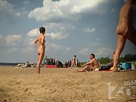 Nu1312# A young pretty woman sunbathing on a nudist beach. Great shots nude beach voyeur. Beautifu