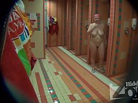 Sh1007# In the shower not a lot of people, a few naked women move through it and we can evaluate t