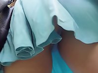 Up3567# Under the skirt of a girl in a blue sundress. Our cameraman caught her round ass and shaved 