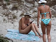 Nu1981# The girls continue to sunbathe, and we continue to watch them. It's a pity, but one of them 